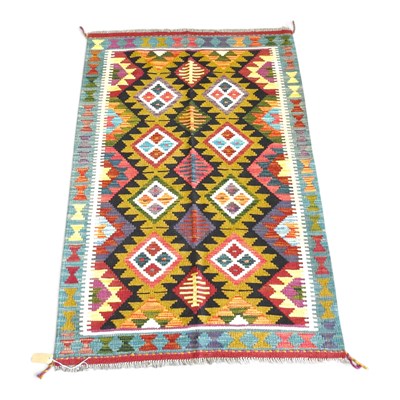 Lot 204 - A Persian kilim rug, with rows of coloured...