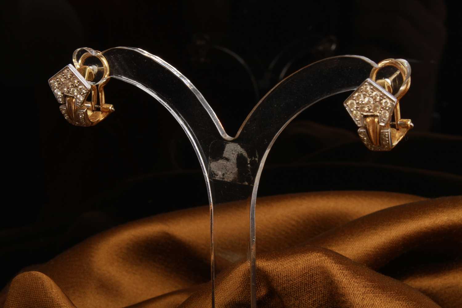 Lot 12 - A pair of 18 carat gold and diamond cluster...