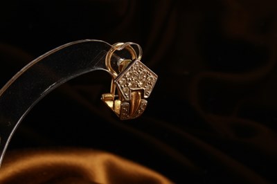 Lot 12 - A pair of 18 carat gold and diamond cluster...