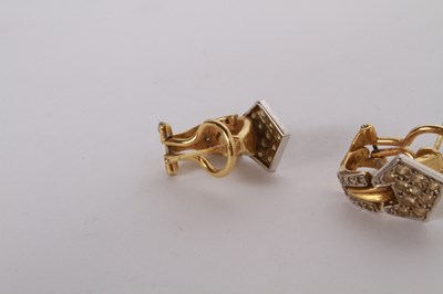 Lot 12 - A pair of 18 carat gold and diamond cluster...