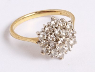 Lot 27 - An 18 carat yellow gold and diamond cluster...