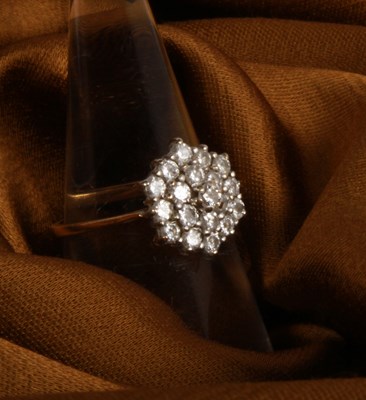 Lot 27 - An 18 carat yellow gold and diamond cluster...