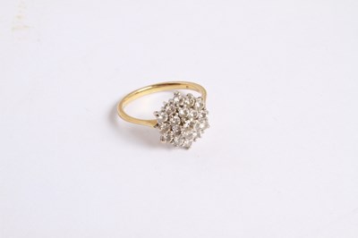 Lot 27 - An 18 carat yellow gold and diamond cluster...
