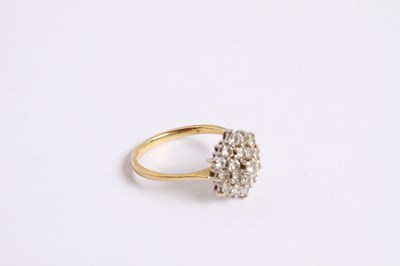 Lot 27 - An 18 carat yellow gold and diamond cluster...