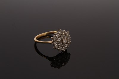 Lot 27 - An 18 carat yellow gold and diamond cluster...
