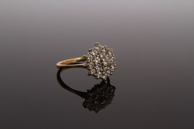 Lot 27 - An 18 carat yellow gold and diamond cluster...