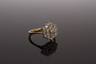 Lot 27 - An 18 carat yellow gold and diamond cluster...