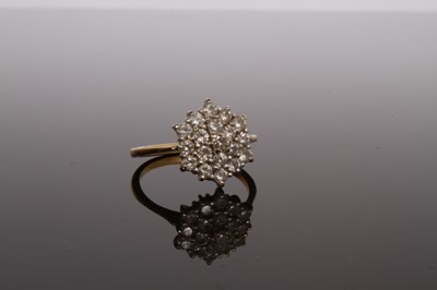 Lot 27 - An 18 carat yellow gold and diamond cluster...