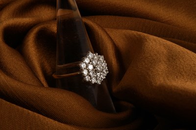 Lot 27 - An 18 carat yellow gold and diamond cluster...