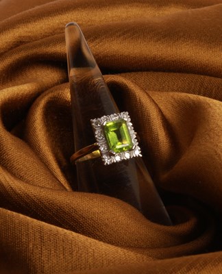 Lot 35 - An 18 carat gold, diamond and peridot cluster...