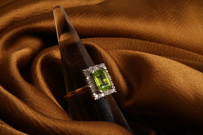Lot 35 - An 18 carat gold, diamond and peridot cluster...