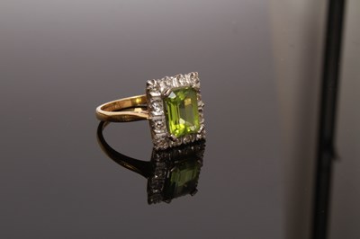 Lot 35 - An 18 carat gold, diamond and peridot cluster...