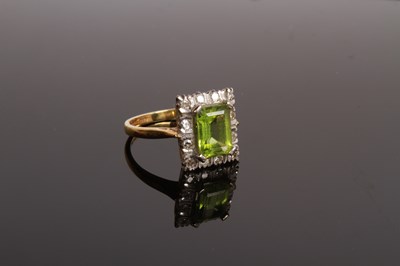 Lot 35 - An 18 carat gold, diamond and peridot cluster...