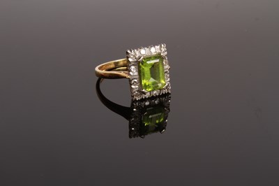 Lot 35 - An 18 carat gold, diamond and peridot cluster...