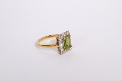 Lot 35 - An 18 carat gold, diamond and peridot cluster...