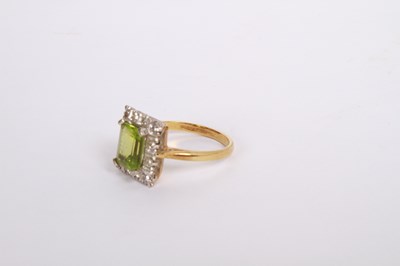 Lot 35 - An 18 carat gold, diamond and peridot cluster...