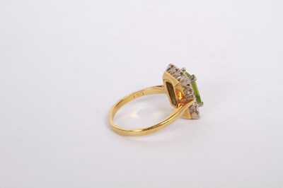 Lot 35 - An 18 carat gold, diamond and peridot cluster...