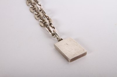 Lot 121 - A Mappin and Webb silver bracelet, ingot...