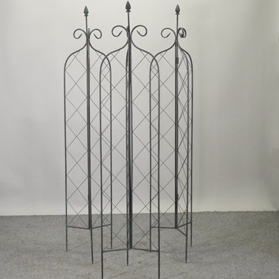Lot 12 - A set of three of metal lattice folding garden spires