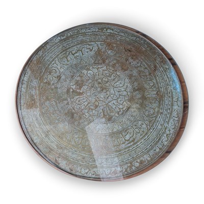 Lot 894 - A Moroccan brass table top, 61cm diameter