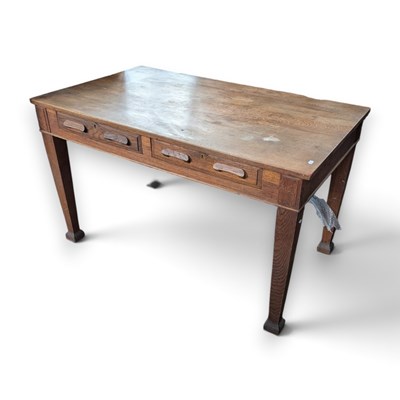 Lot 827 - A 1920s oak writing table