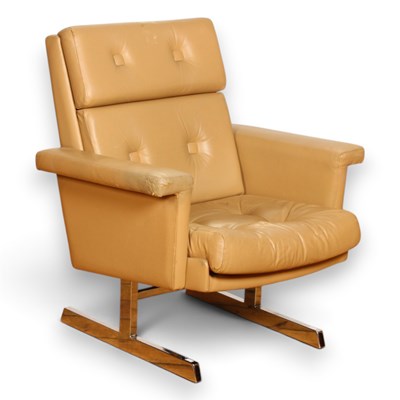 Lot 419 - A tan leather and chrome armchair