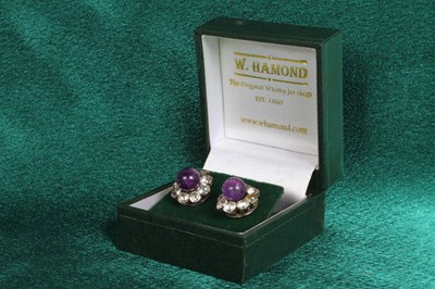 Lot 133 - A pair of silver amethyst and paste set earrings