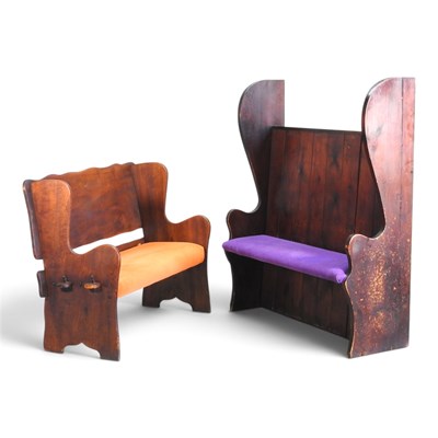 Lot 511 - A pine settle, with a boarded back and cushion...