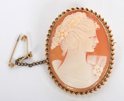 Lot 103 - A 9 carat gold carved shell cameo brooch with...