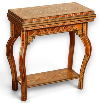 Lot 698 - A Moroccan inlaid folding games table