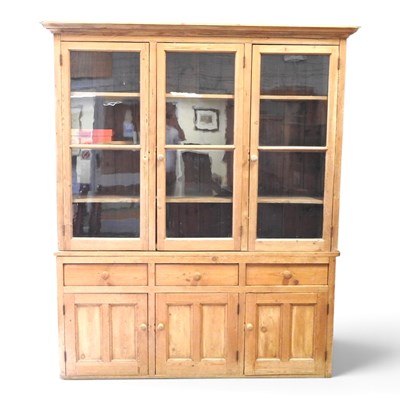 Lot 69 - A large mid 20th century pine glazed bookcase,...