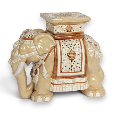 Lot 895 - A ceramic elephant plant stand with a beige...