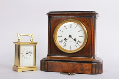 Lot 464 - A Victorian walnut mantel clock, having an 8...