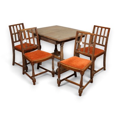Lot 432 - An Arts and Crafts limed oak extending dining...