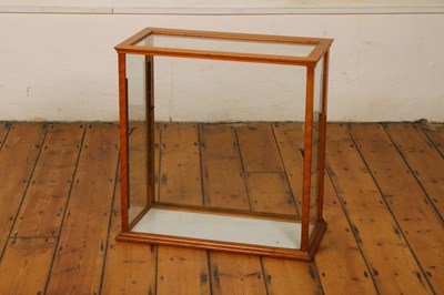 Lot 700 - An early 20th century oak glazed table top...