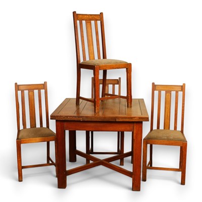 Lot 722 - A 1920s oak draw-leaf dining table and four...