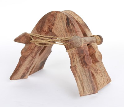 Lot 908 - An African carved wood miniature camel pack...
