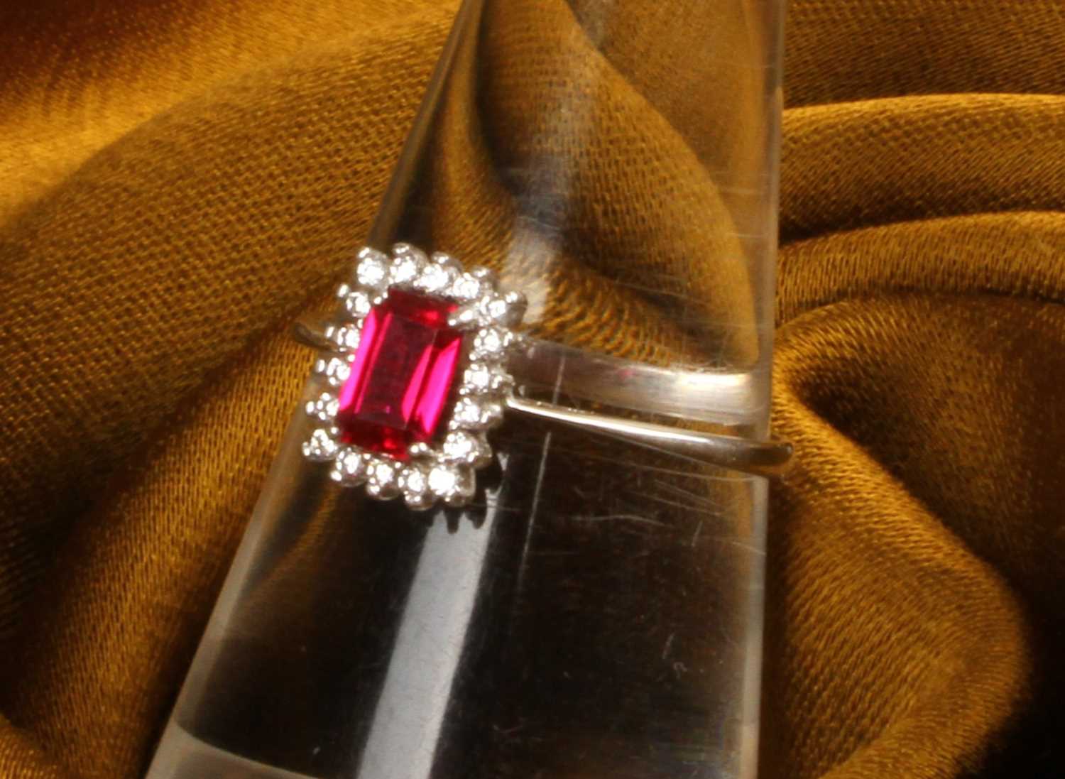 Lot 24 - A modern 18 carat white gold, ruby and diamond...