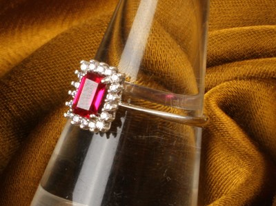 Lot 24 - A modern 18 carat white gold, ruby and diamond...
