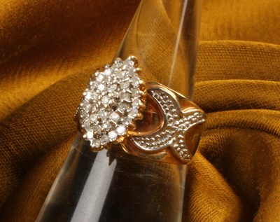 Lot 15 - An 10 carat gold diamond cluster ring, of...