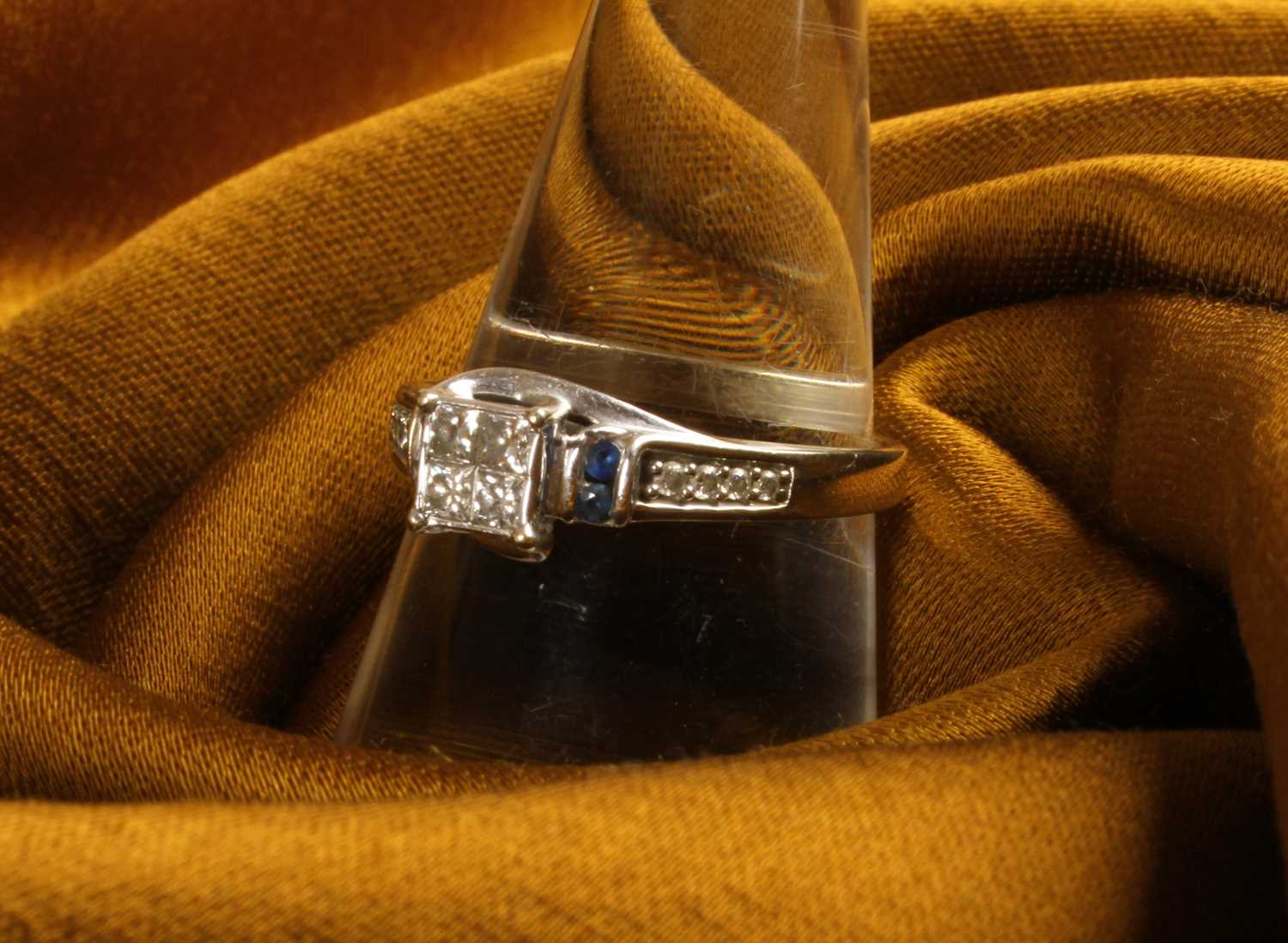 Lot 38 - A 10 carat white gold and diamond princess cut...