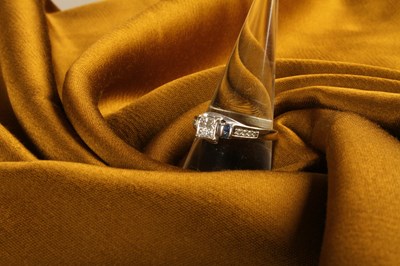 Lot 38 - A 10 carat white gold and diamond princess cut...