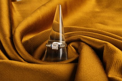 Lot 38 - A 10 carat white gold and diamond princess cut...