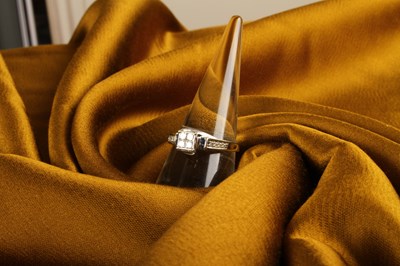 Lot 38 - A 10 carat white gold and diamond princess cut...