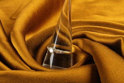 Lot 18 - An 18 carat gold diamond solitaire ring, with...