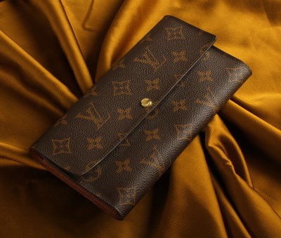 Lot 86 - A Louis Vuitton wallet, with a fitted interior...