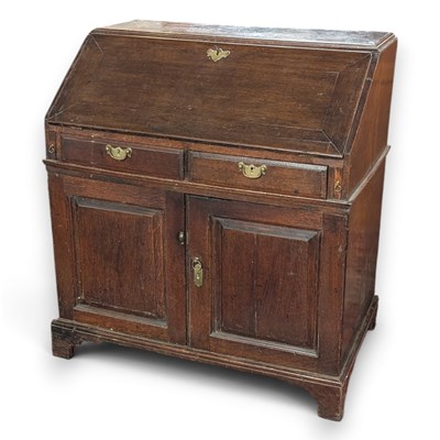 Lot 709 - A George III oak bureau, w. 98cm