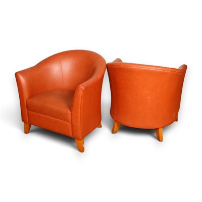 Lot 717 - A pair of tan leather tub armchairs