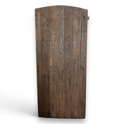 Lot 778 - An arched oak cottage door, 183x80cm