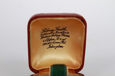 Lot 7 - An 18 carat gold and platinum emerald ring,...
